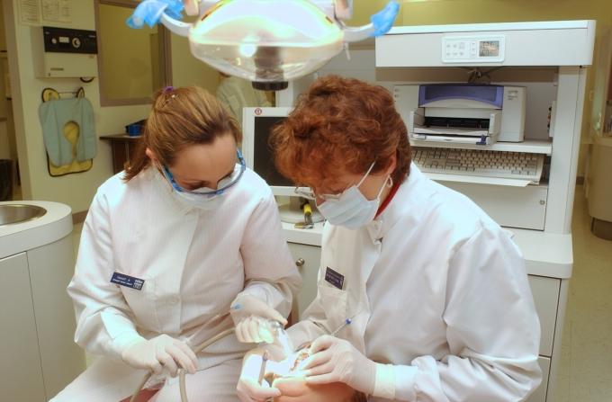 Dental Hygienist Work on Patient